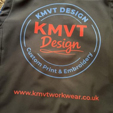 Black custom branded workwear garment with large KMVT Design back print logo and website printing by KMVT Workwear